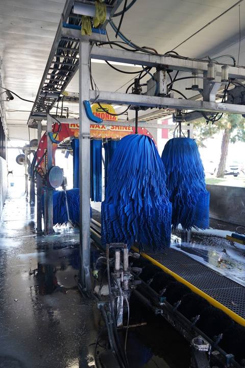 Blue foam brushes inside the Stars and Stripes wash tunnel